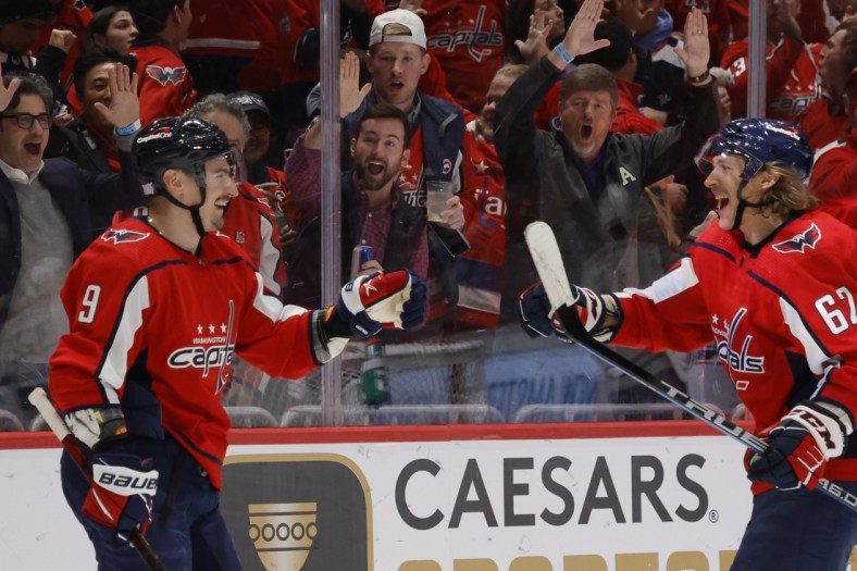 Nov 24, 2021; Washington, District of Columbia, USA; Washington Capitals defenseman Dmitry Orlov (9) celebrates with Capitals left wing Carl Hagelin (62) after scoring a goal against the Montreal Canadiens during the third period at Capital One Arena. Mandatory Credit: Geoff Burke-USA TODAY Sports