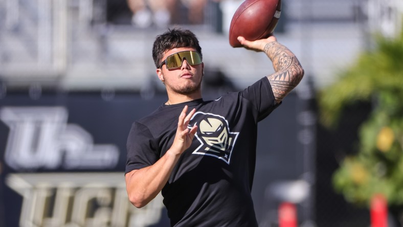 Nov 26, 2021; Orlando, Florida, USA; UCF Knights quarterback Dillon Gabriel (11) throws before the game against the South Florida Bulls at Bounce House. Mandatory Credit: Mike Watters-USA TODAY Sports