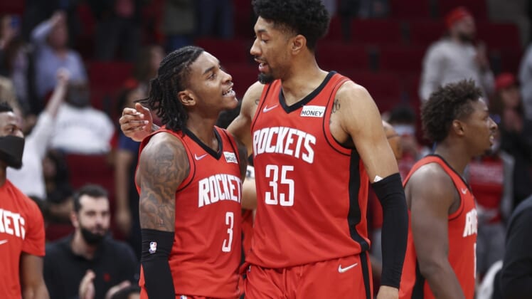 Nov 27, 2021; Houston, Texas, USA; Houston Rockets guard Kevin Porter Jr. (3) and center Christian Wood (35) react after a play during overtime against the Charlotte Hornets at Toyota Center. Mandatory Credit: Troy Taormina-USA TODAY Sports