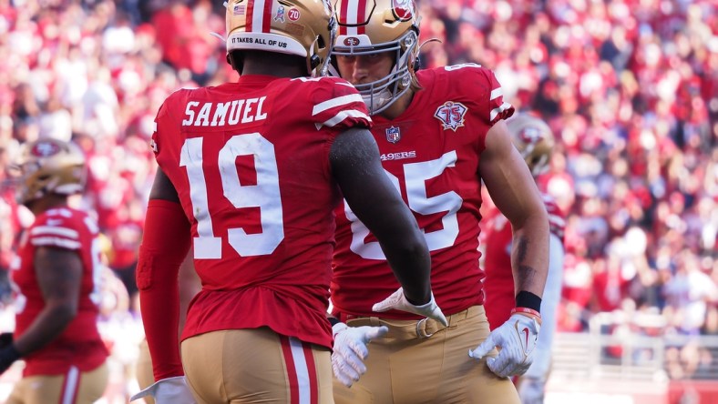 Nov 28, 2021; Santa Clara, California, USA; San Francisco 49ers wide receiver Deebo Samuel (19) celebrates with tight end George Kittle (85) after scoring a touchdown against the Minnesota Vikings during the first quarter at Levi's Stadium. Mandatory Credit: Kelley L Cox-USA TODAY Sports