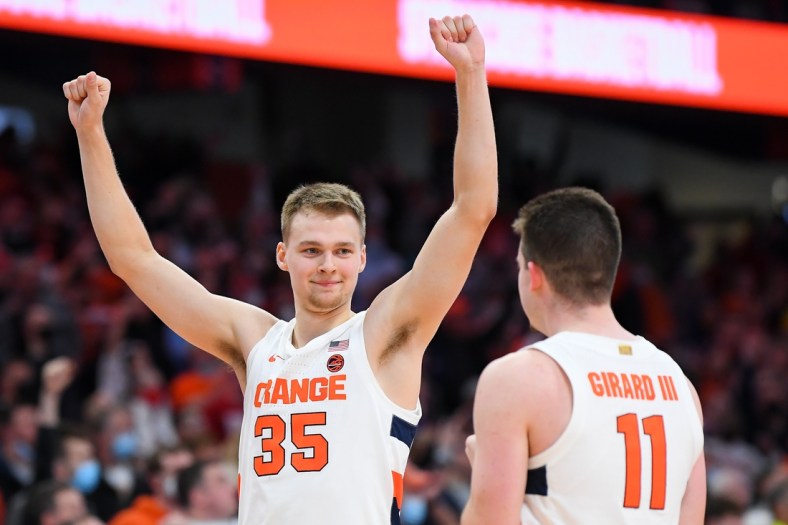 Nov 30, 2021; Syracuse, New York, USA; Syracuse Orange guard Buddy Boeheim (35) celebrates with teammate guard Joseph Girard III (11) following the game against the Indiana Hoosiers at the Carrier Dome. Mandatory Credit: Rich Barnes-USA TODAY Sports