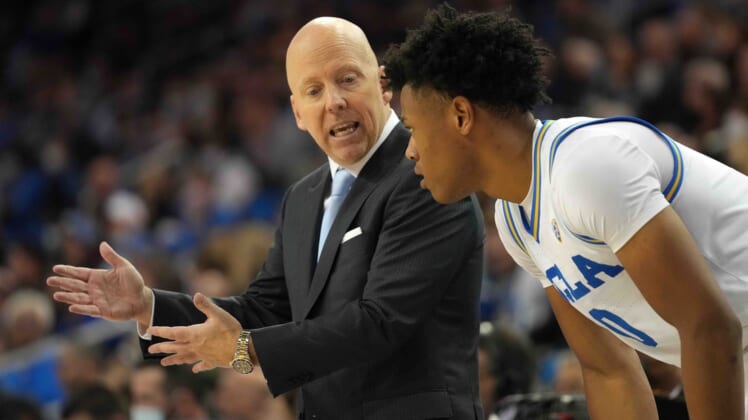 Dec 1, 2021; Los Angeles, California, USA; UCLA Bruins head coach Mick Cronin (left) talks with guard Jaylen Clark (0) against the Colorado Buffaloes in the second half at Pauley Pavilion. Mandatory Credit: Kirby Lee-USA TODAY Sports