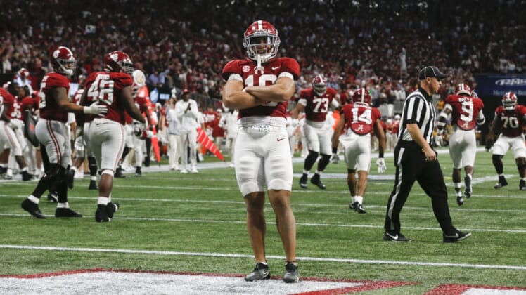 Dec 4, 2021; Atlanta, GA, USA; Alabama Crimson Tide linebacker Henry To'o To'o (10) celebrates after a stop against the Georgia Bulldogs on a fourth down with seconds left on the clock during the SEC championship game at Mercedes-Benz Stadium. Alabama won 41-24. Mandatory Credit: Gary Cosby Jr.-USA TODAY Sports