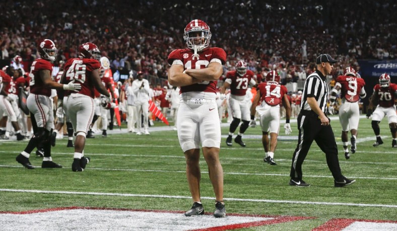 Dec 4, 2021; Atlanta, GA, USA; Alabama Crimson Tide linebacker Henry To'o To'o (10) celebrates after a stop against the Georgia Bulldogs on a fourth down with seconds left on the clock during the SEC championship game at Mercedes-Benz Stadium. Alabama won 41-24. Mandatory Credit: Gary Cosby Jr.-USA TODAY Sports