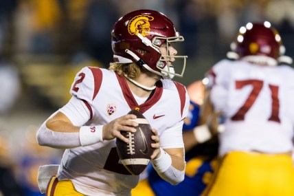 Dec 4, 2021; Berkeley, California, USA; USC Trojans quarterback Jaxson Dart (2) run the ball against the California Golden Bears during the first quarter at FTX Field at California Memorial Stadium. Mandatory Credit: John Hefti-USA TODAY Sports