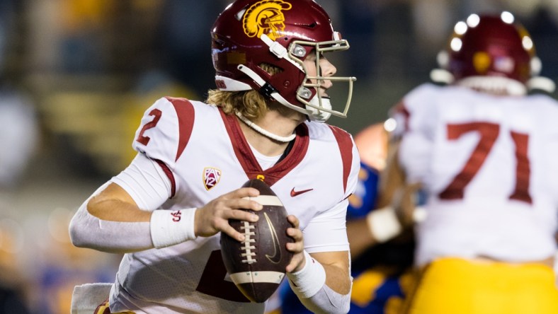 Dec 4, 2021; Berkeley, California, USA; USC Trojans quarterback Jaxson Dart (2) run the ball against the California Golden Bears during the first quarter at FTX Field at California Memorial Stadium. Mandatory Credit: John Hefti-USA TODAY Sports