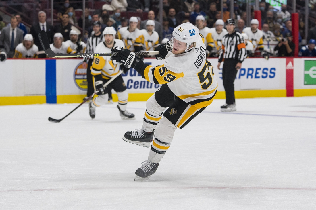 Dec 4, 2021; Vancouver, British Columbia, CAN; Pittsburgh Penguins forward Jake Guentzel (59) scores his third goal against the Vancouver Canucks in the second period at Rogers Arena. Mandatory Credit: Bob Frid-USA TODAY Sports