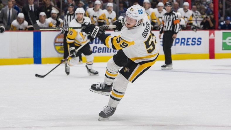 Dec 4, 2021; Vancouver, British Columbia, CAN; Pittsburgh Penguins forward Jake Guentzel (59) scores his third goal against the Vancouver Canucks in the second period at Rogers Arena. Mandatory Credit: Bob Frid-USA TODAY Sports