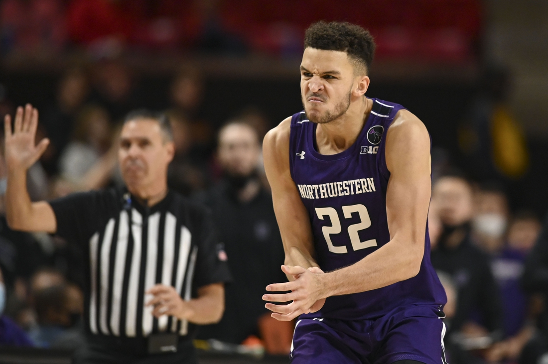 Dec 5, 2021; College Park, Maryland, USA;  Northwestern Wildcats forward Pete Nance (22) reacts after making a contested three point basket against the Maryland Terrapins during the second half at Xfinity Center. Mandatory Credit: Tommy Gilligan-USA TODAY Sports