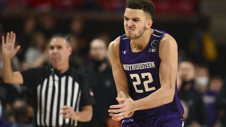 Dec 5, 2021; College Park, Maryland, USA;  Northwestern Wildcats forward Pete Nance (22) reacts after making a contested three point basket against the Maryland Terrapins during the second half at Xfinity Center. Mandatory Credit: Tommy Gilligan-USA TODAY Sports