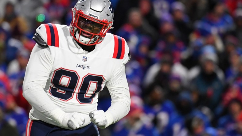 Dec 6, 2021; Orchard Park, New York, USA; New England Patriots defensive end Christian Barmore (90) reacts to a defensive play against the Buffalo Bills during the first half at Highmark Stadium. Mandatory Credit: Rich Barnes-USA TODAY Sports