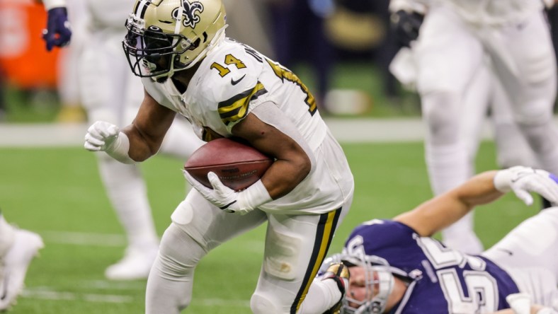 Dec 2, 2021; New Orleans, Louisiana, USA; New Orleans Saints running back Mark Ingram II (14) and Dallas Cowboys linebacker Leighton Vander Esch (55) during the first half at Caesars Superdome. Mandatory Credit: Stephen Lew-USA TODAY Sports