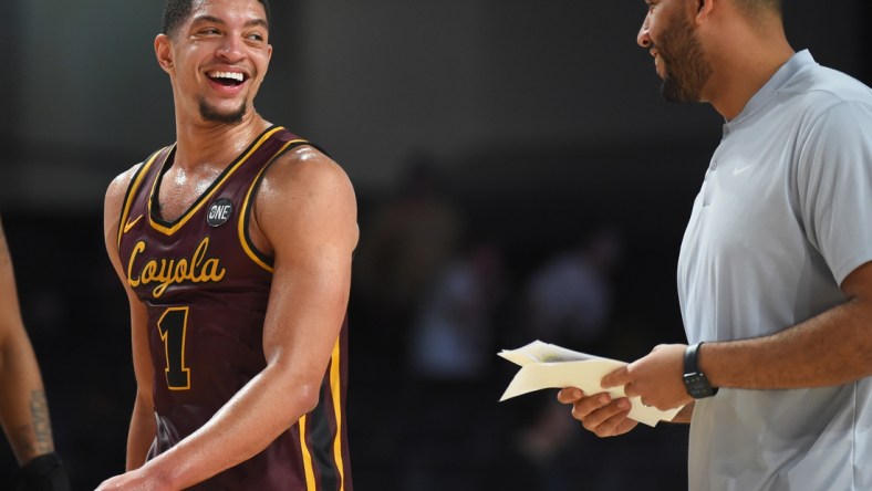 Dec 10, 2021; Nashville, Tennessee, USA; Loyola Ramblers guard Lucas Williamson (1) and Loyola Ramblers head coach Drew Valentine after a win against the Vanderbilt Commodores at Memorial Gymnasium. Mandatory Credit: Christopher Hanewinckel-USA TODAY Sports