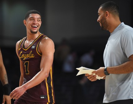 Dec 10, 2021; Nashville, Tennessee, USA; Loyola Ramblers guard Lucas Williamson (1) and Loyola Ramblers head coach Drew Valentine after a win against the Vanderbilt Commodores at Memorial Gymnasium. Mandatory Credit: Christopher Hanewinckel-USA TODAY Sports