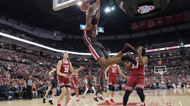 Ohio State Buckeyes forward Zed Key (23) dunks over Wisconsin Badgers guard Chucky Hepburn (23) during the first half of the NCAA men's basketball game at Value City Arena in Columbus on Saturday, Dec. 11, 2021.Key dunk 1