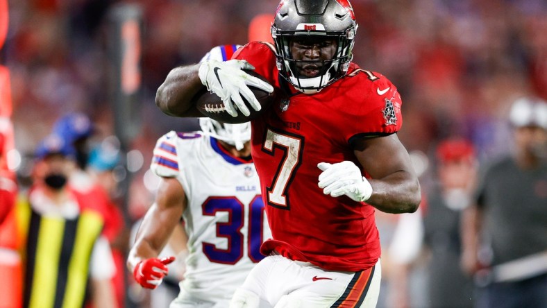 Dec 12, 2021; Tampa, Florida, USA;  Tampa Bay Buccaneers running back Leonard Fournette (7) runs with the ball in the second half against the Buffalo Bills at Raymond James Stadium. Mandatory Credit: Nathan Ray Seebeck-USA TODAY Sports