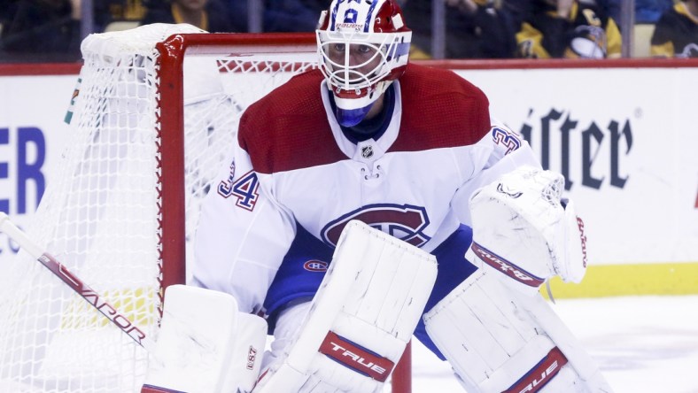 Dec 14, 2021; Pittsburgh, Pennsylvania, USA;  Montreal Canadiens goaltender Jake Allen (34) guards the net against the Pittsburgh Penguins during the second period at PPG Paints Arena. Mandatory Credit: Charles LeClaire-USA TODAY Sports