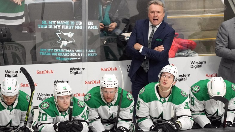 Dec 11, 2021; San Jose, California, USA; Dallas Stars head coach Rick Bowness talks on the bench during the third period against the San Jose Sharks at SAP Center at San Jose. Mandatory Credit: Darren Yamashita-USA TODAY Sports