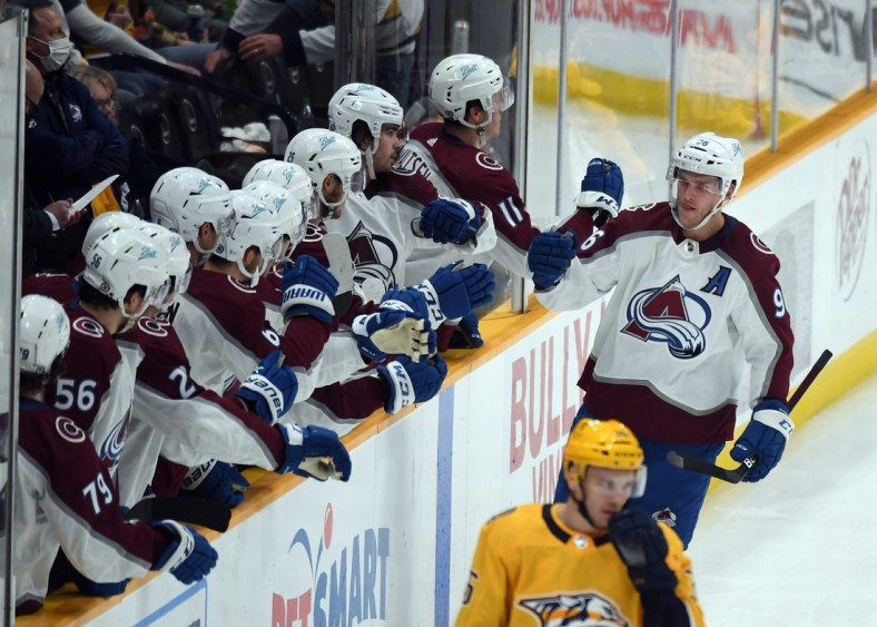 Dec 16, 2021; Nashville, Tennessee, USA; Colorado Avalanche players celebrate after a goal by right wing Mikko Rantanen (96) during the second period against the Nashville Predators at Bridgestone Arena. Mandatory Credit: Christopher Hanewinckel-USA TODAY Sports