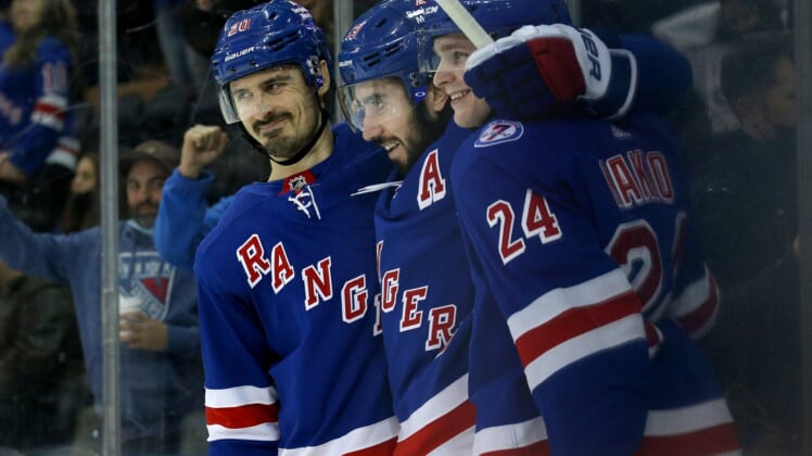 Dec 17, 2021; New York, New York, USA; New York Rangers center Mika Zibanejad (93) celebrates his goal against the Vegas Golden Knights with left wing Chris Kreider (20) and right wing Kaapo Kakko (24) during the second period at Madison Square Garden. Mandatory Credit: Brad Penner-USA TODAY Sports