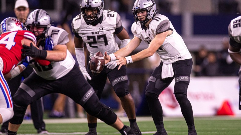 Guyer quarterback Jackson Arnold (11) snaps the ball against Westlake during the Class 6A Division 2 State Championship game at AT&T Stadium in Arlington, Texas on Dec. 18, 2021. Westlake defeated Guyer 40-21.

Aem Westlake Vs Guyer 11