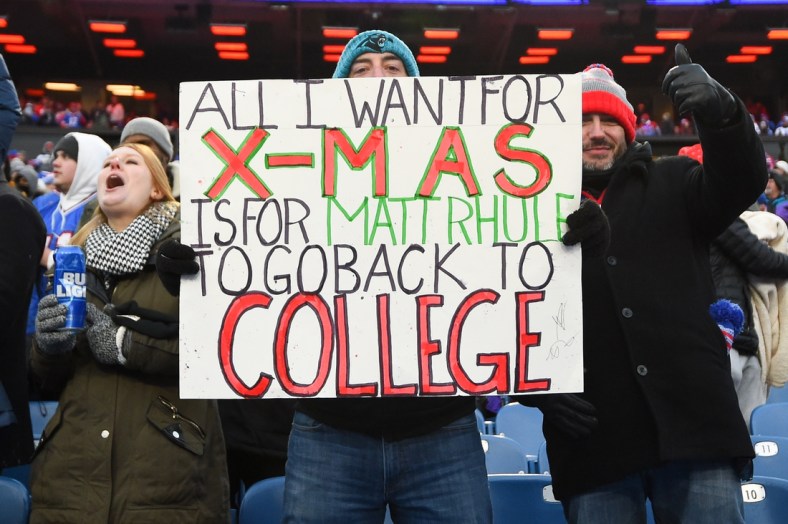 Dec 19, 2021; Orchard Park, New York, USA; Carolina Panthers fans hold a sign for Carolina Panthers head coach Matt Rhule (not pictured) against the Buffalo Bills during the second half at Highmark Stadium. Mandatory Credit: Rich Barnes-USA TODAY Sports