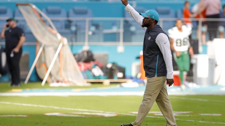 Dec 19, 2021; Miami Gardens, Florida, USA; Miami Dolphins head coach Brian Flores waves at fans after winning the game against the New York Jets at Hard Rock Stadium. Mandatory Credit: Sam Navarro-USA TODAY Sports