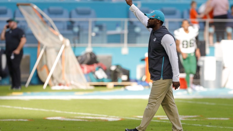 Dec 19, 2021; Miami Gardens, Florida, USA; Miami Dolphins head coach Brian Flores waves at fans after winning the game against the New York Jets at Hard Rock Stadium. Mandatory Credit: Sam Navarro-USA TODAY Sports