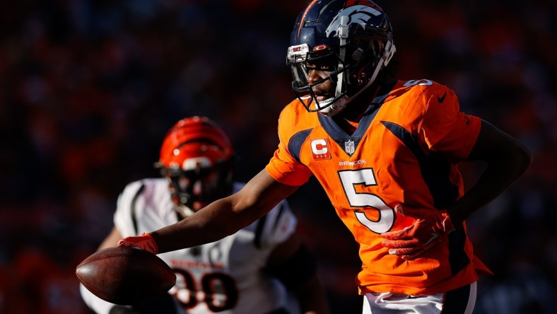 Dec 19, 2021; Denver, Colorado, USA; Denver Broncos quarterback Teddy Bridgewater (5) looks to hand off the ball in the second quarter against the Cincinnati Bengals at Empower Field at Mile High. Mandatory Credit: Isaiah J. Downing-USA TODAY Sports