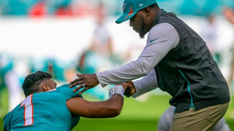Miami Dolphins head coach Brian Flores, shakes hands withMiami Dolphins quarterback Tua Tagovailoa (1) before the start of the game against the New York Jets during NFL game at Hard Rock Stadium Sunday in Miami Gardens.New York Jet V Miami Dolphins 09