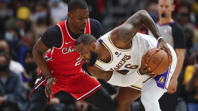 Dec 19, 2021; Chicago, Illinois, USA; Chicago Bulls forward Javonte Green (24) defends against Los Angeles Lakers forward LeBron James (6) during the first half at United Center. Mandatory Credit: Kamil Krzaczynski-USA TODAY Sports