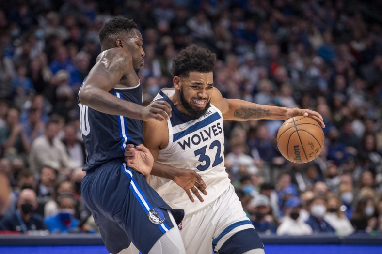 Dec 21, 2021; Dallas, Texas, USA; Minnesota Timberwolves center Karl-Anthony Towns (32) drives to the basket past Dallas Mavericks forward Dorian Finney-Smith (10) during the second half at the American Airlines Center. Mandatory Credit: Jerome Miron-USA TODAY Sports