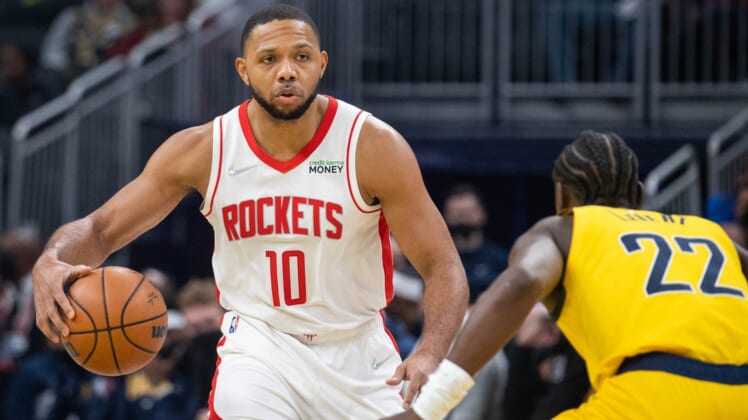 Dec 23, 2021; Indianapolis, Indiana, USA; Houston Rockets guard Eric Gordon (10) dribbles the ball while Indiana Pacers guard Caris LeVert (22) defends in the first quarter at Gainbridge Fieldhouse. Mandatory Credit: Trevor Ruszkowski-USA TODAY Sports