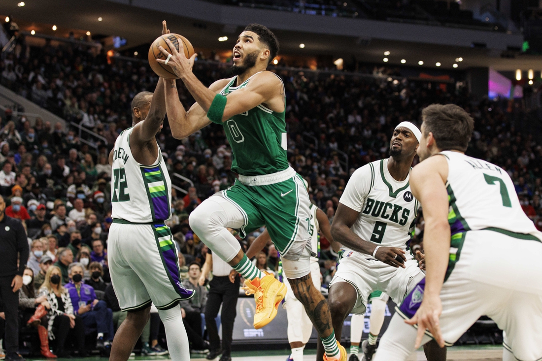 Dec 25, 2021; Milwaukee, Wisconsin, USA;  Boston Celtics forward Jayson Tatum (0) drives for the basket during the fourth quarter against the Milwaukee Bucks at Fiserv Forum. Mandatory Credit: Jeff Hanisch-USA TODAY Sports