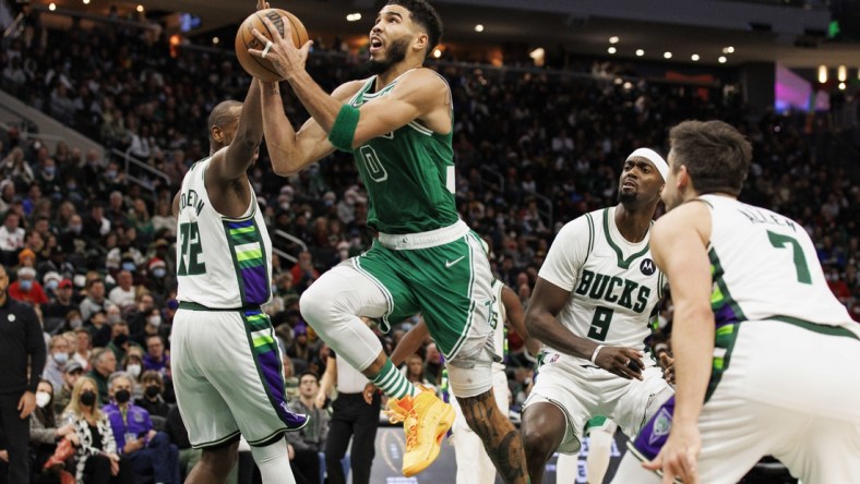 Dec 25, 2021; Milwaukee, Wisconsin, USA;  Boston Celtics forward Jayson Tatum (0) drives for the basket during the fourth quarter against the Milwaukee Bucks at Fiserv Forum. Mandatory Credit: Jeff Hanisch-USA TODAY Sports