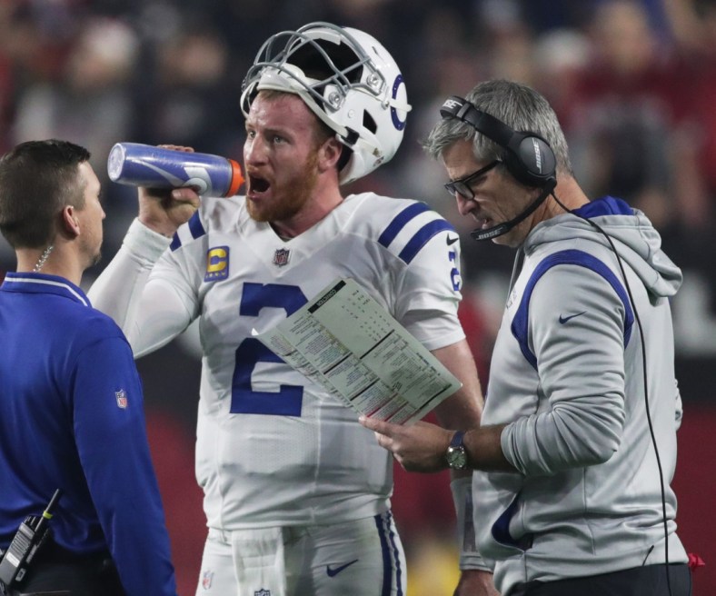 Indianapolis Colts quarterback Carson Wentz (2) gets water during a timeout against Arizona, Saturday, Dec. 25, 2021, at State Farm Stadium in Glendale, Ariz.

Indianapolis Colts At Arizona Cardinals At State Farm Stadium In Glendale Ariz On Saturday Dec 25 2021 Christmas Day Nfl