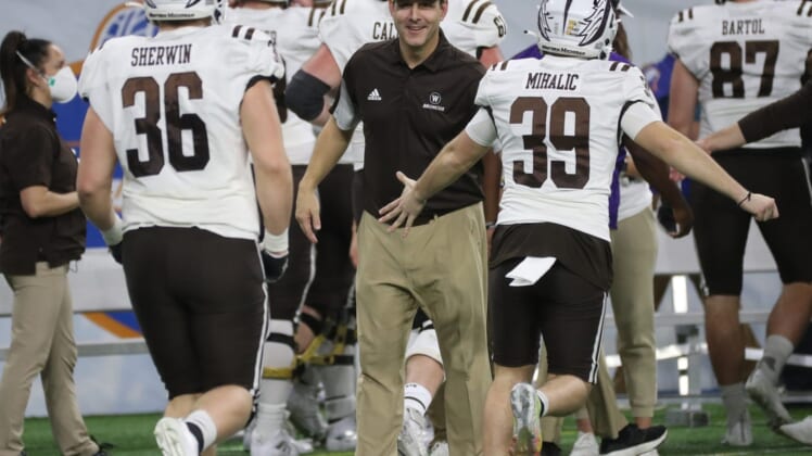 Western Michigan head coach Tim Lester congratulates his players Monday, Dec. 27, 2021, during the Broncos' 52-24 win over the Nevada Wolf Pack in the Quick Lane Bowl at Ford Field.Quick Lane