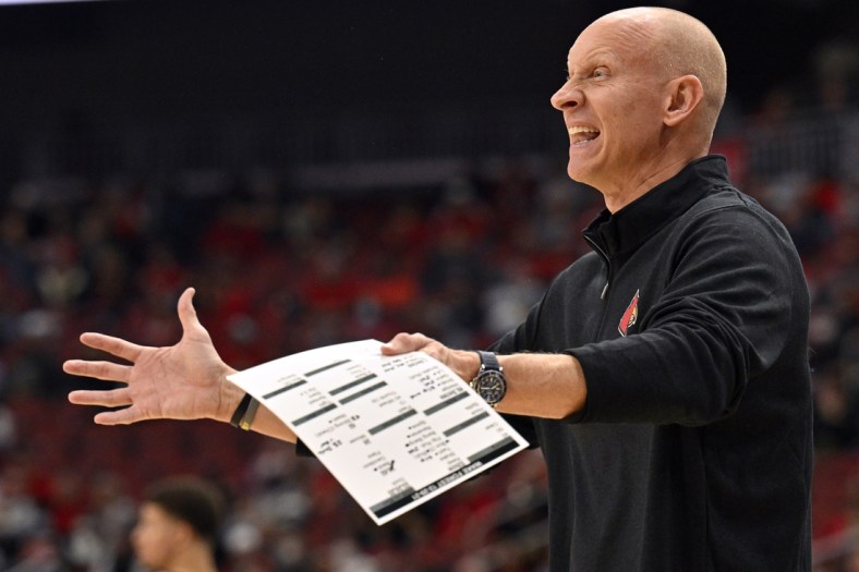 Dec 29, 2021; Louisville, Kentucky, USA;  Louisville Cardinals head coach Chris Mack reacts during the first half against the Wake Forest Demon Deacons at KFC Yum! Center. Mandatory Credit: Jamie Rhodes-USA TODAY Sports