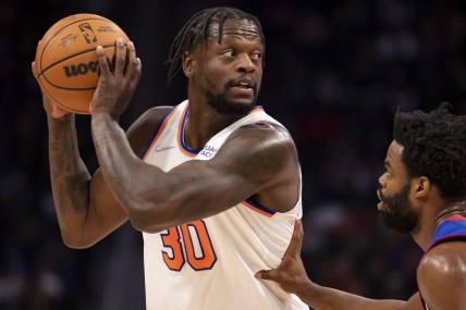 Dec 29, 2021; Detroit, Michigan, USA; New York Knicks forward Julius Randle (30) gets defended by Detroit Pistons guard Derrick Walton Jr. (25) during the second quarter at Little Caesars Arena. Mandatory Credit: Raj Mehta-USA TODAY Sports