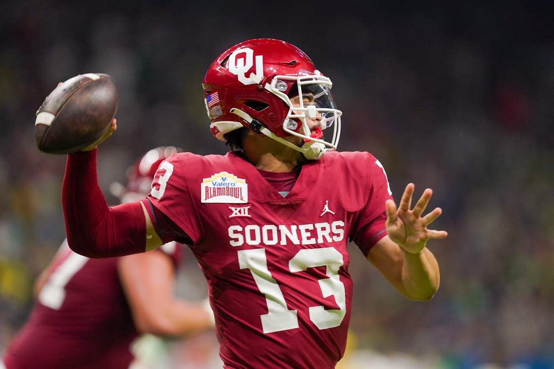 Dec 29, 2021; San Antonio, Texas, USA; Oklahoma Sooners quarterback Caleb Williams (13) throws a pass during the first half of the 2021 Alamo Bowl against the Oregon Ducks at the Alamodome. Mandatory Credit: Daniel Dunn-USA TODAY Sports