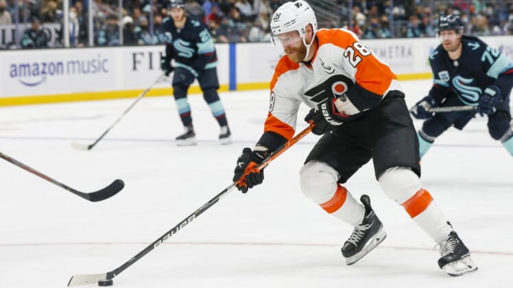 Dec 29, 2021; Seattle, Washington, USA; Philadelphia Flyers center Claude Giroux (28) skates with the puck against the Seattle Kraken during the second period at Climate Pledge Arena. Mandatory Credit: Joe Nicholson-USA TODAY Sports