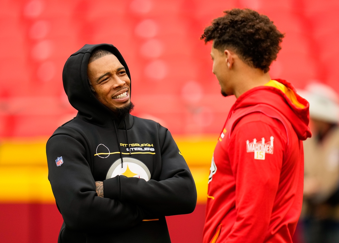 Dec 26, 2021; Kansas City, Missouri, USA; Pittsburgh Steelers cornerback Joe Haden (23) talks with Kansas City Chiefs quarterback Patrick Mahomes (15) before the game at GEHA Field at Arrowhead Stadium. Mandatory Credit: Jay Biggerstaff-USA TODAY Sports