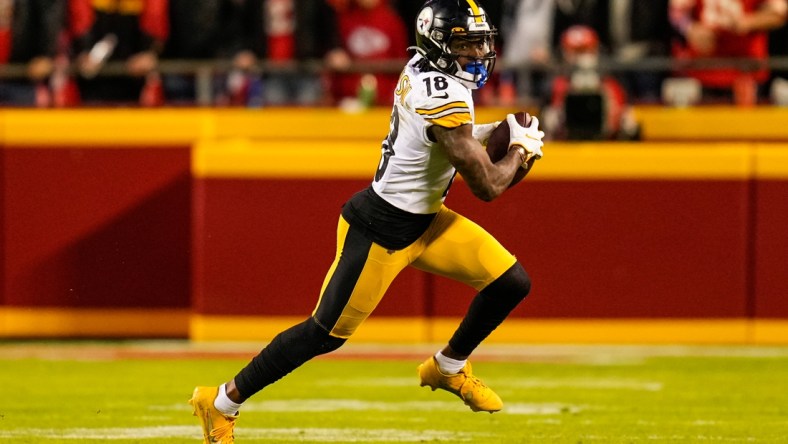 Dec 26, 2021; Kansas City, Missouri, USA; Pittsburgh Steelers wide receiver Diontae Johnson (18) runs the ball against the Kansas City Chiefs during the second half at GEHA Field at Arrowhead Stadium. Mandatory Credit: Jay Biggerstaff-USA TODAY Sports