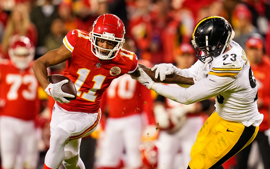 Dec 26, 2021; Kansas City, Missouri, USA; Kansas City Chiefs wide receiver Demarcus Robinson (11) runs the ball against Pittsburgh Steelers inside linebacker Joe Schobert (93) during the second half at GEHA Field at Arrowhead Stadium. Mandatory Credit: Jay Biggerstaff-USA TODAY Sports