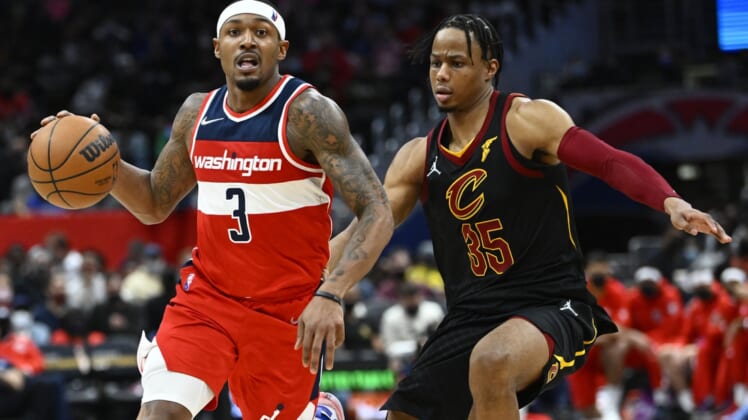 Dec 30, 2021; Washington, District of Columbia, USA; Washington Wizards guard Bradley Beal (3) dribbles past Cleveland Cavaliers forward Isaac Okoro (35) during the second half at Capital One Arena. Mandatory Credit: Brad Mills-USA TODAY Sports