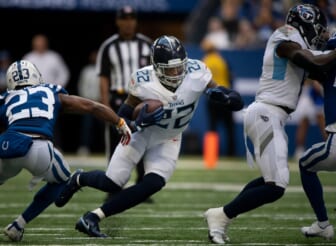 Tennessee Titans running back Derrick Henry (22) runs through the Indianapolis Colts defense during the game at Lucas Oil Stadium Sunday, Oct. 31, 2021 in Indianapolis, Ind.Nas Titans Colts 020