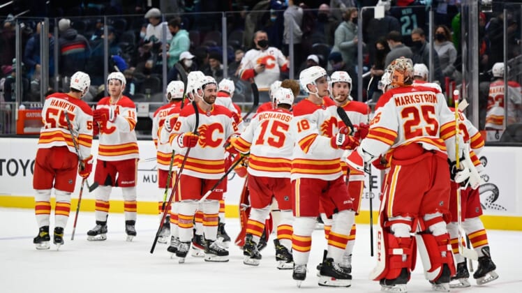 Dec 30, 2021; Seattle, Washington, USA; The Calgary Flames celebrate after defeating the Seattle Kraken at Climate Pledge Arena. Calgary defeated Seattle 6-4. Mandatory Credit: Steven Bisig-USA TODAY Sports