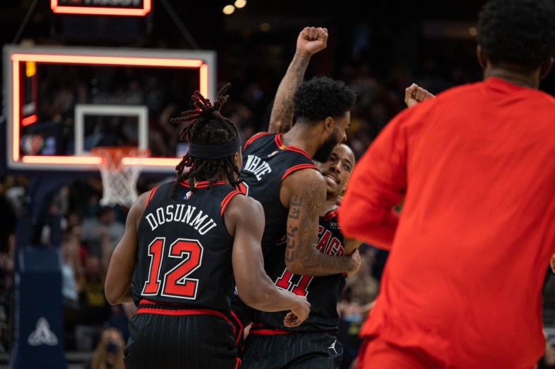 Dec 31, 2021; Indianapolis, Indiana, USA; Chicago Bulls forward DeMar DeRozan (11) celebrates his game winning basket with teammates as time expires against the Indiana Pacers at Gainbridge Fieldhouse. Mandatory Credit: Trevor Ruszkowski-USA TODAY Sports