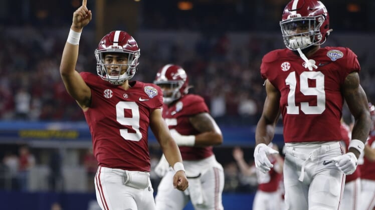 Dec 31, 2021; Arlington, Texas, USA; Alabama Crimson Tide quarterback Bryce Young (9) reacts after throwing a touchdown in the fourth quarter against the Cincinnati Bearcats during the 2021 Cotton Bowl college football CFP national semifinal game at AT&T Stadium. Mandatory Credit: Tim Heitman-USA TODAY Sports