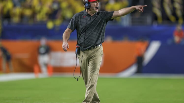 Dec 31, 2021; Miami Gardens, Florida, USA; Georgia Bulldogs head coach Kirby Smart gestures in the fourth quarter against the Michigan Wolverines during the Orange Bowl college football CFP national semifinal game at Hard Rock Stadium. Mandatory Credit: Sam Navarro-USA TODAY Sports